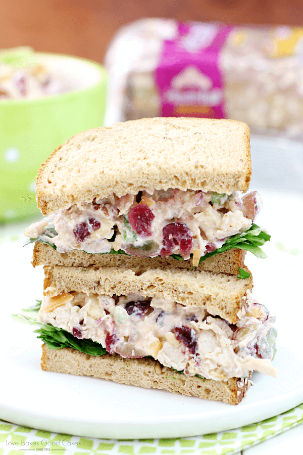 Lighter Chicken Salad Sandwiches stacked on a white plate.