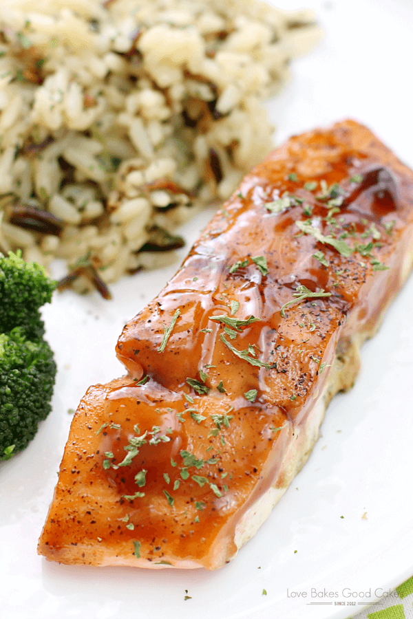 Dr Pepper Glazed Salmon on a white plate with rice pilaf.