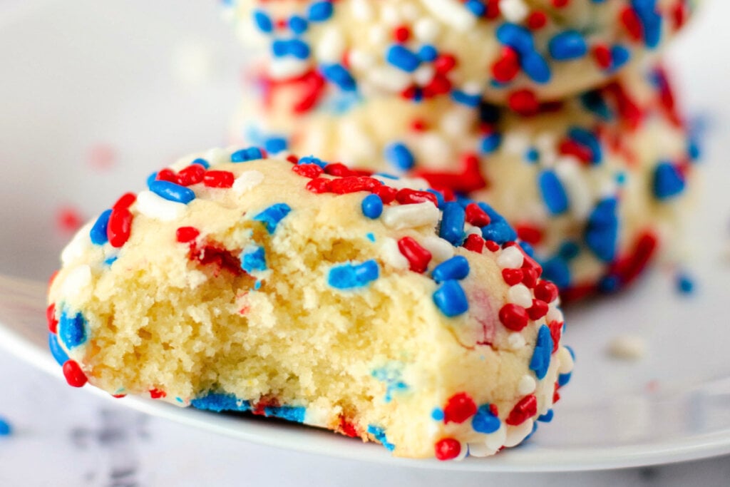 patriotic sprinkle cookie with a bite taken out