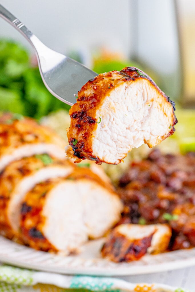 cut piece of margarita chicken on fork