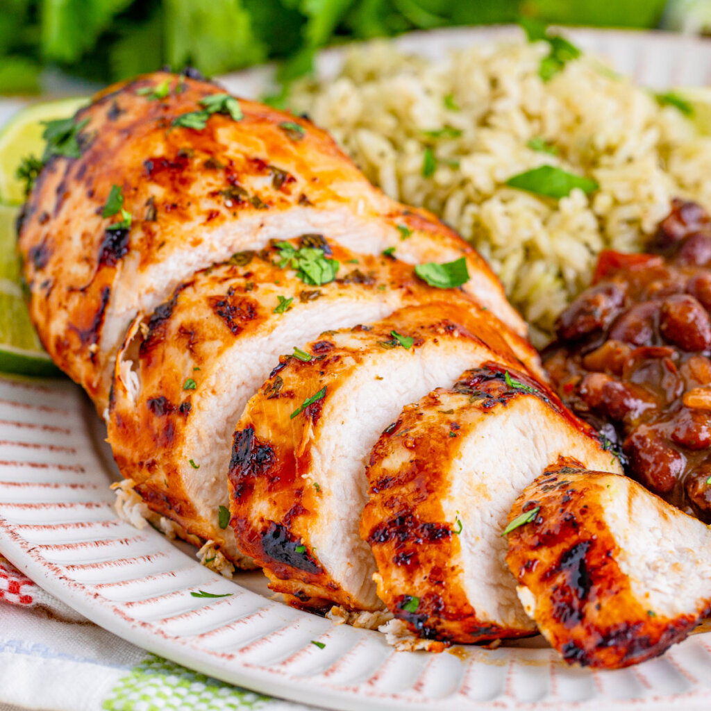 sliced margarita chicken on white plate