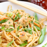 Spicy dragon noodles in a white bowl.