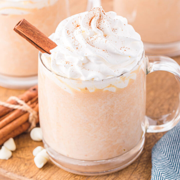 cup of pumpkin spice white hot chocolate with whipped topping on top