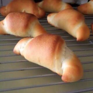 Crescent rolls on a cooling rack.