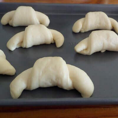 Crescent rolls on a cookie sheet.