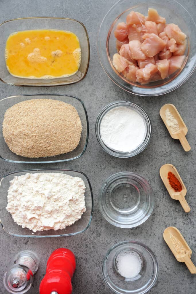 Ingredients for homemade chicken nuggets arranged before preparing the recipe.