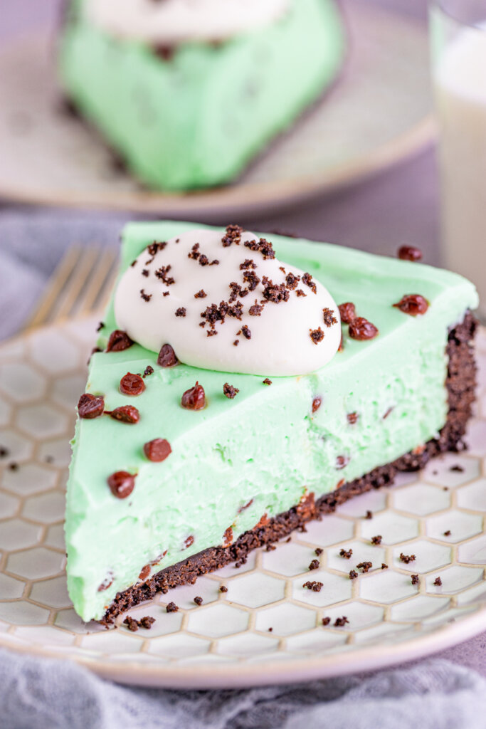 slice of mint chocolate chip cheesecake on plate