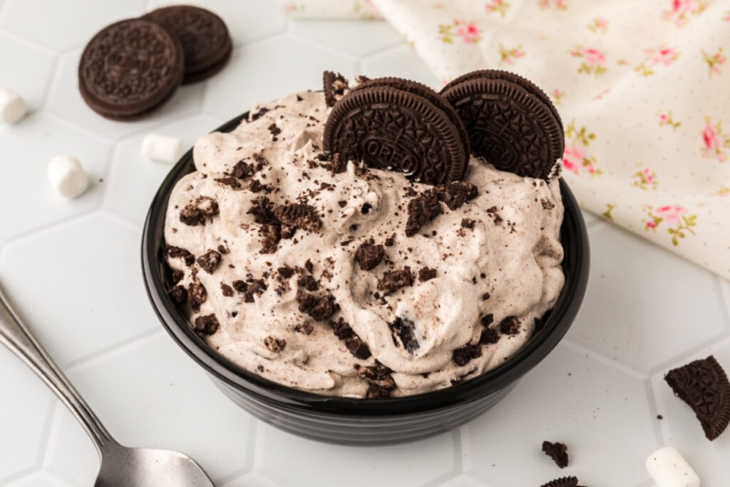 oreo fluff salad in black bowl