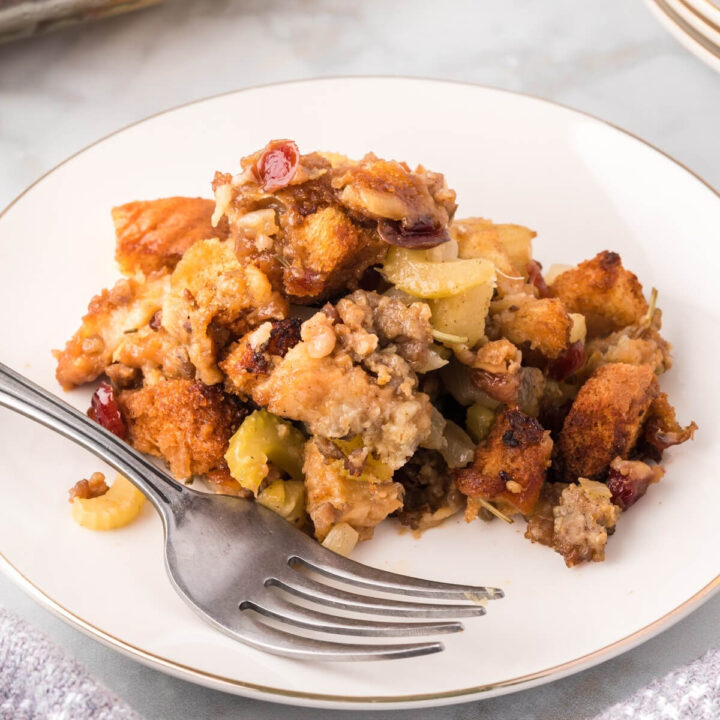 Cranberry Apple Sausage Stuffing on plate with fork