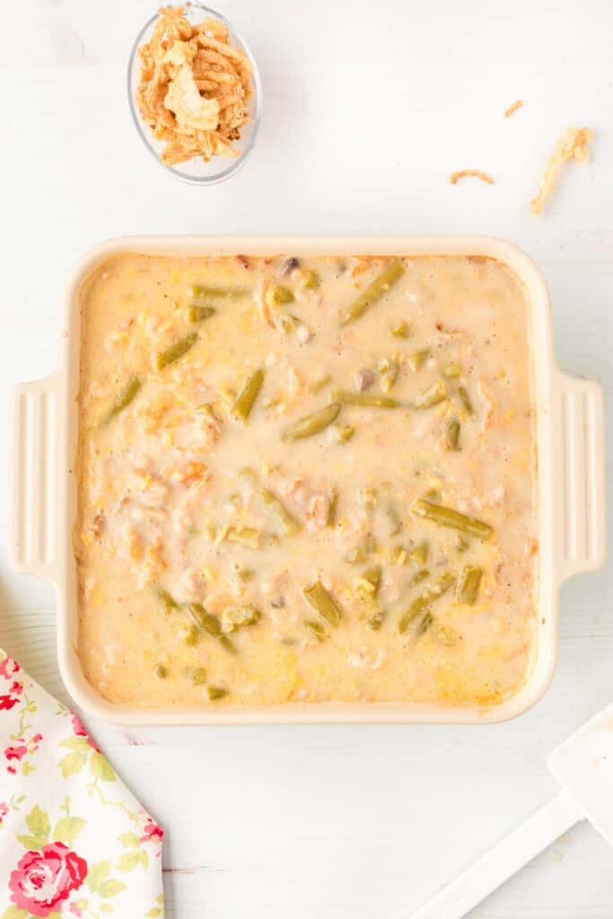 Creamy green bean casserole after baking and before the final layer of crispy fried onions is added