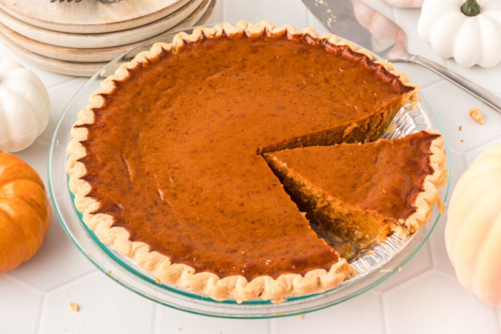 pumpkin pie with slice cut