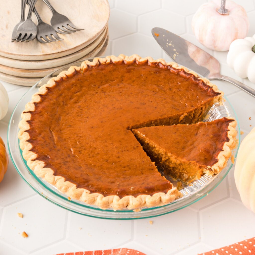 pumpkin pie with slice cut