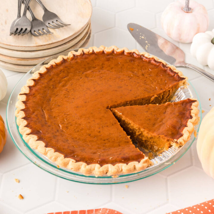 pumpkin pie with slice cut