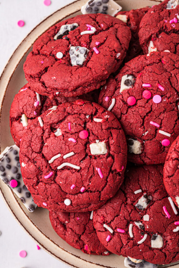 red velvet cookies stacked on plate