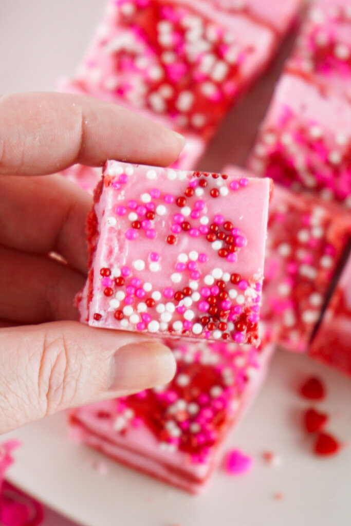 hand holding a piece of fudge