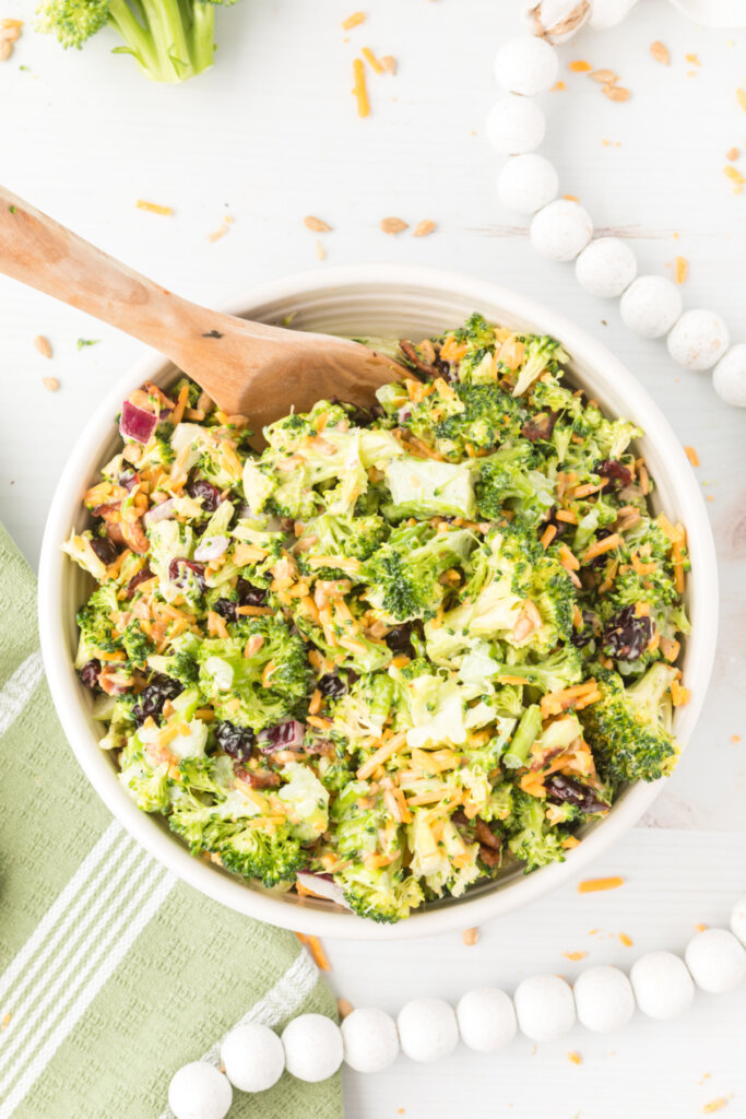 bowl of broccoli salad with serving spoon