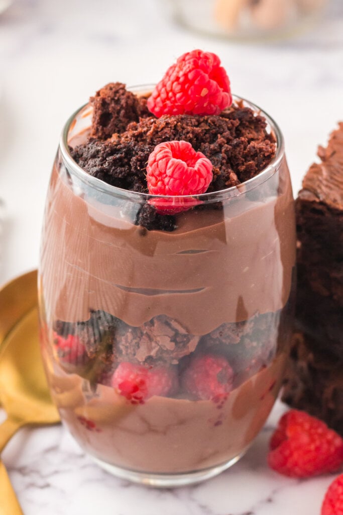 brownie parfait with raspberries in glass