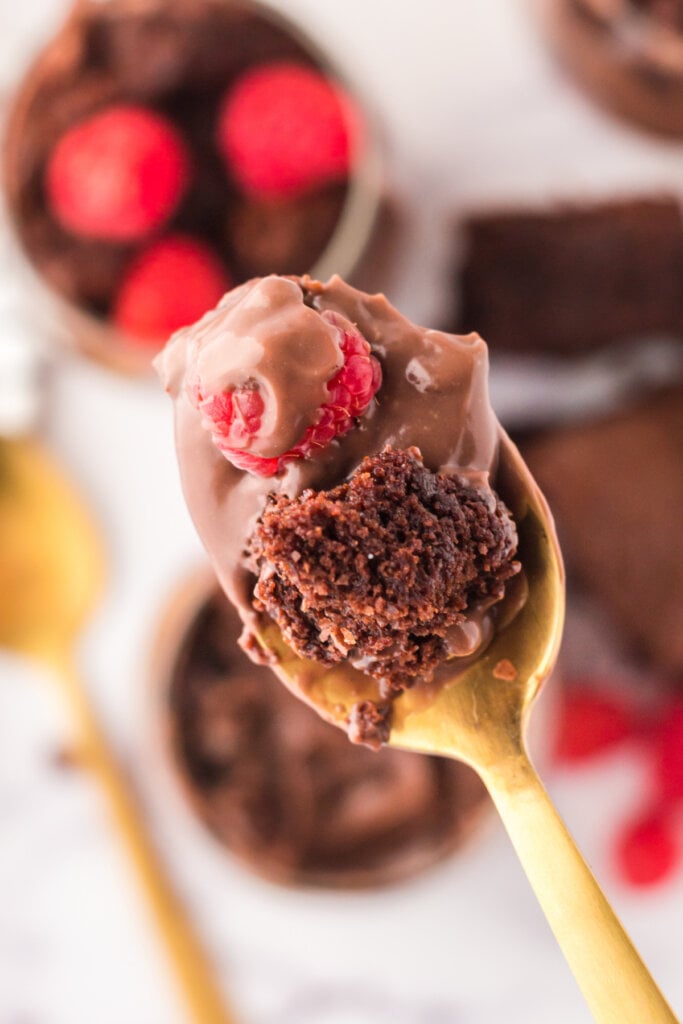 bite of brownie parfait on gold spoon