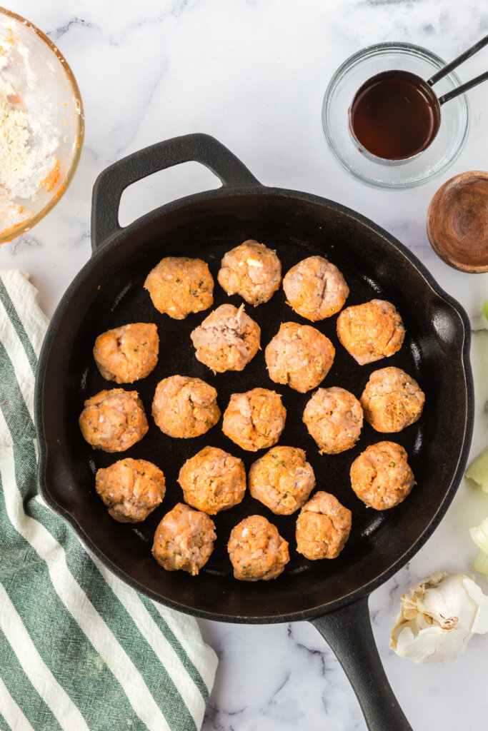 chicken meatballs in cast-iron skillet