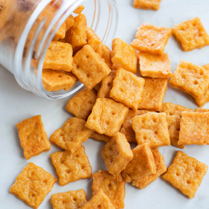 cheese crackers spilling out of glass jar