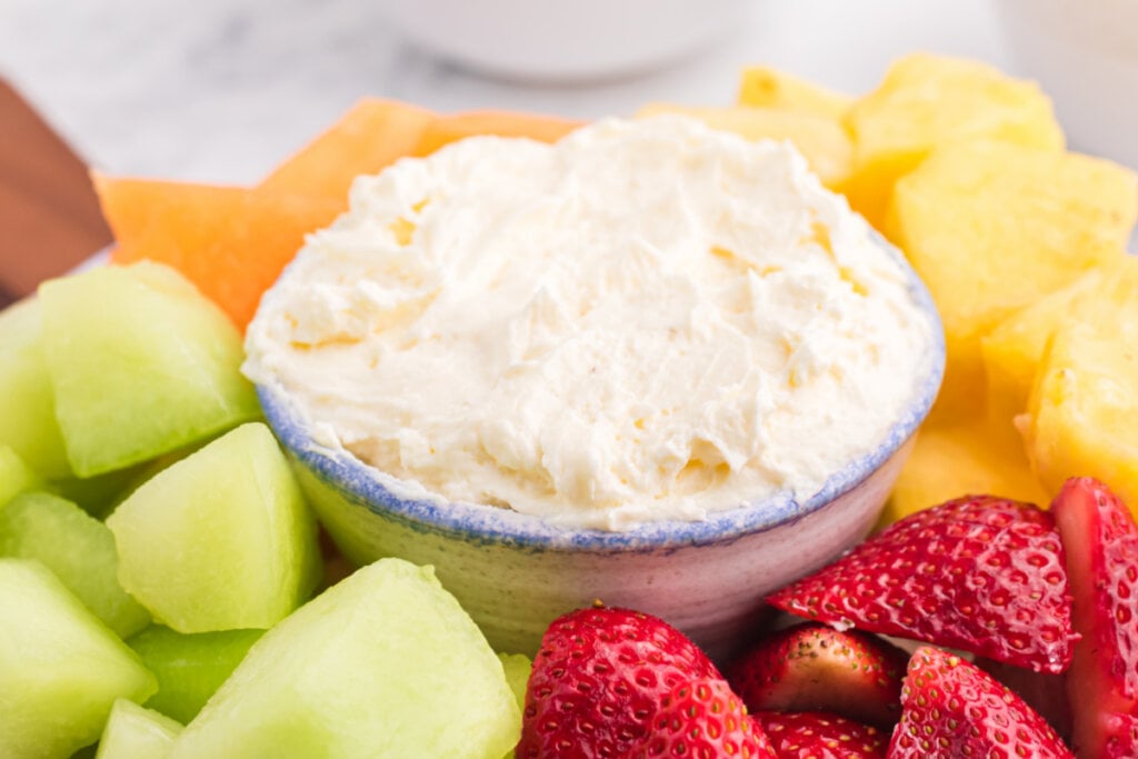 cream cheese fruit dip surrounded by fruit