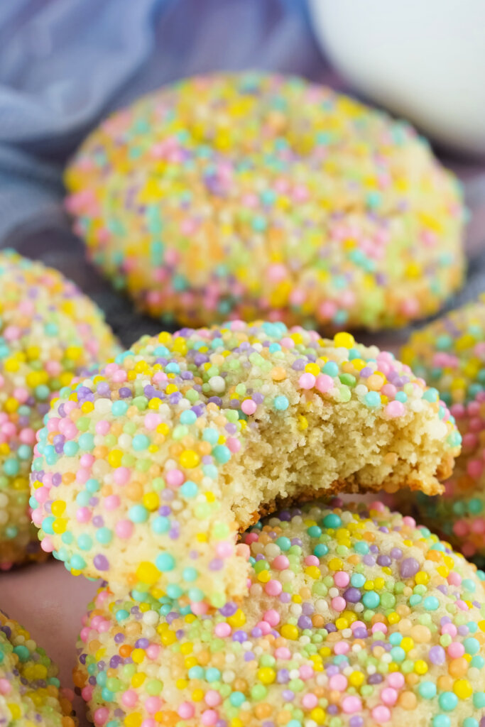 bite taken out of sugar sprinkle cookies recipe