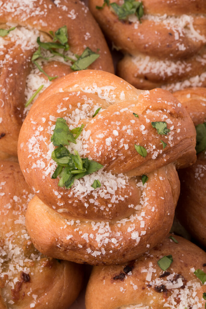 garlic knots stacked on top of each other