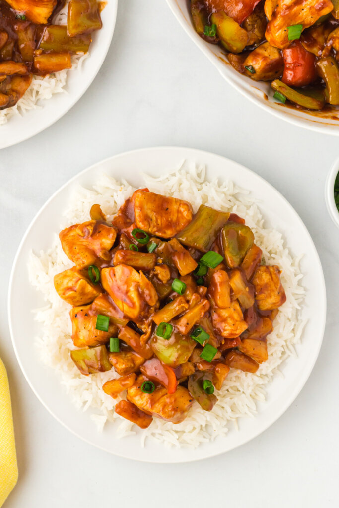 looking down onto a plate with hawaiian chicken over rice