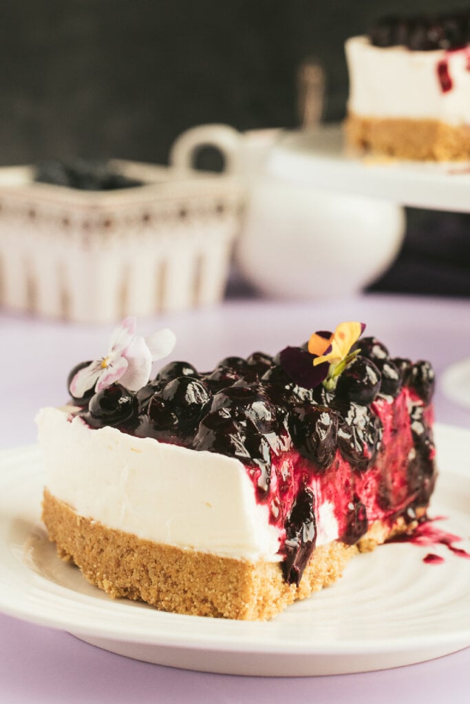 slice of no-bake blueberry cheesecake on plate