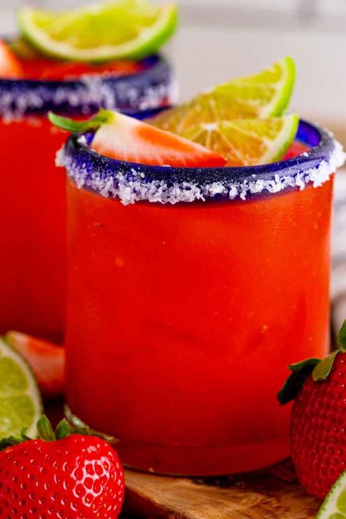 strawberry margarita on the rocks in glass