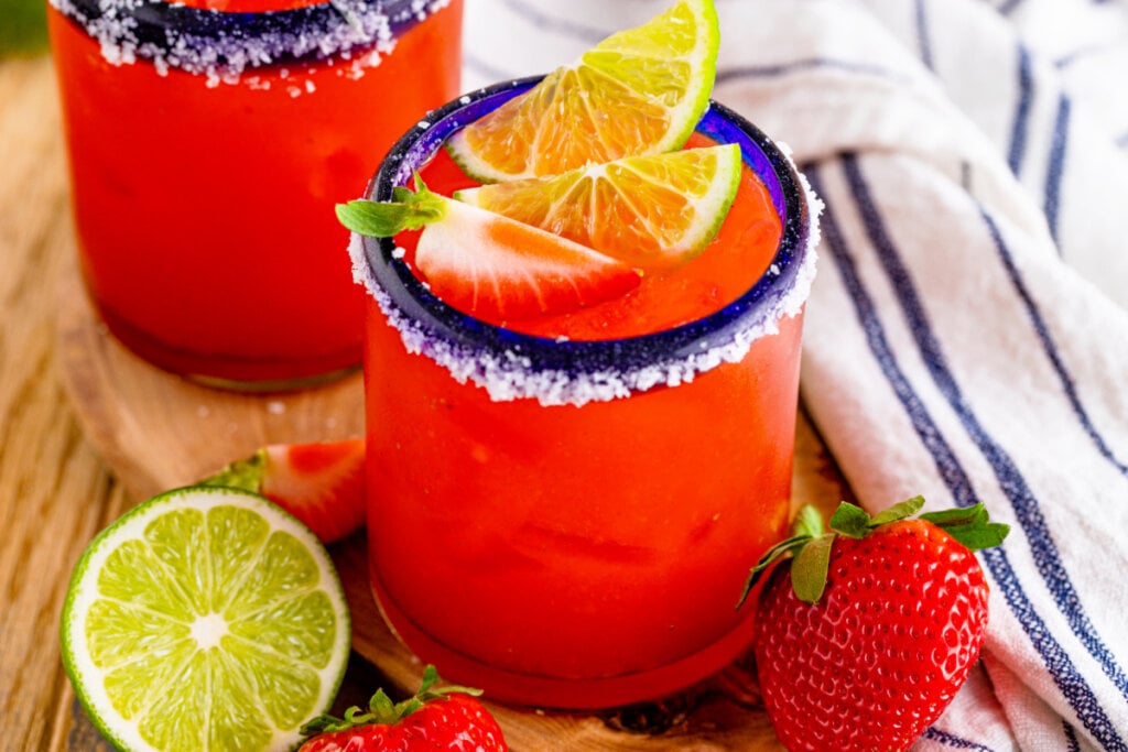 strawberry margarita in blue-rimmed glass