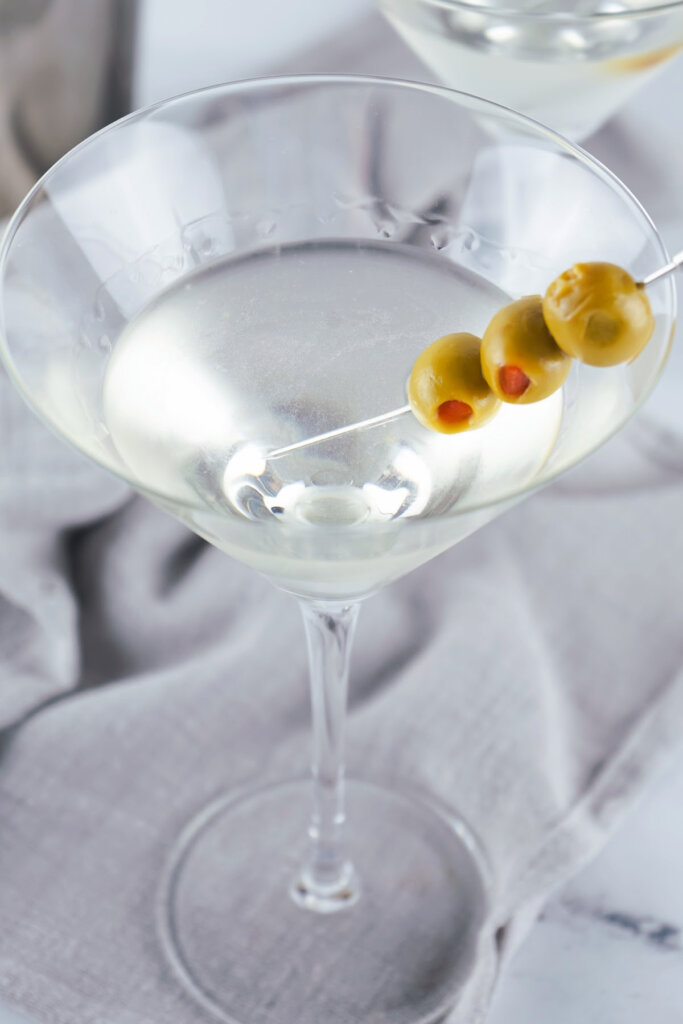 martini drink with three olives