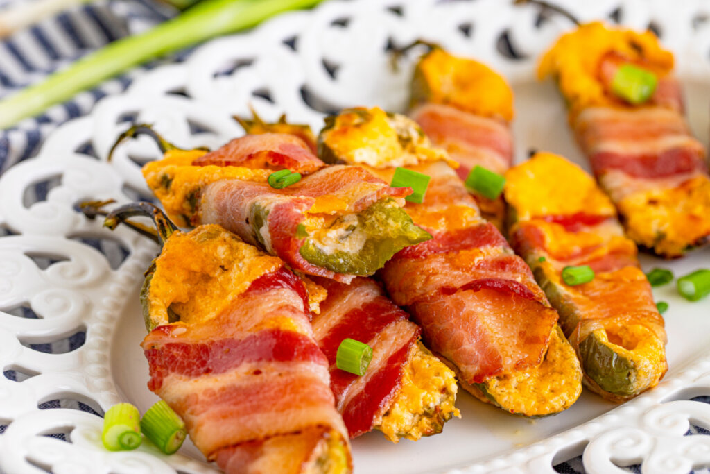 bacon wrapped jalapeno poppers on plate