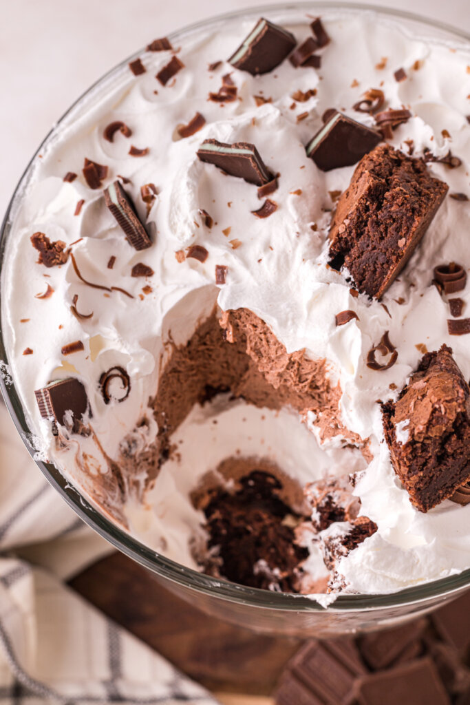 looking down into a brownie trifle with a scoop taken out