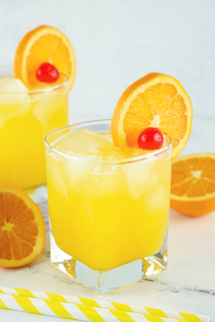 two fuzzy navel cockatils in glasses