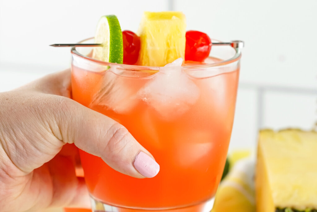 hand holding rum punch