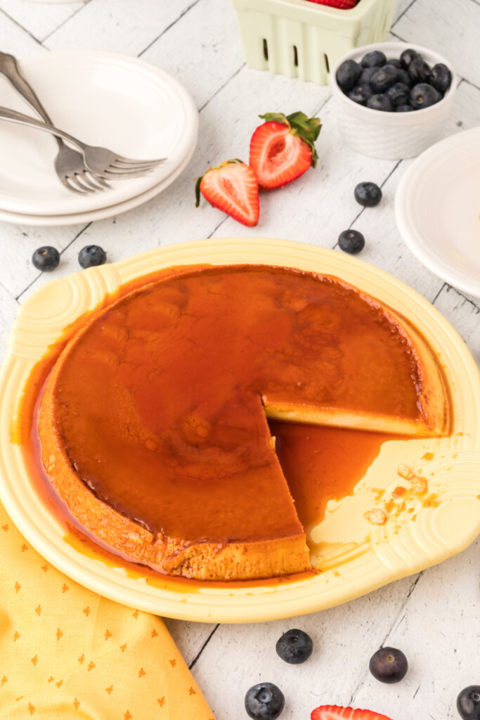 spanish flan on plate with slice out