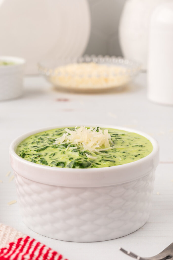 creamed spinach in white bowl