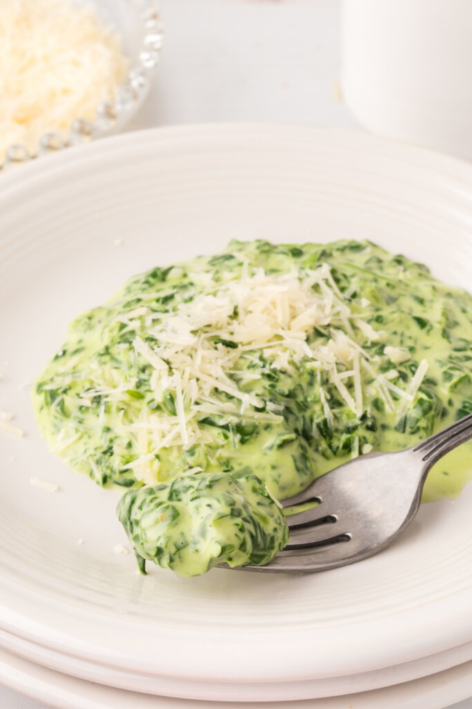 creamed spinach with fork on plate