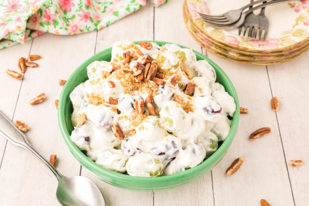 creamy grape salad in green bowl