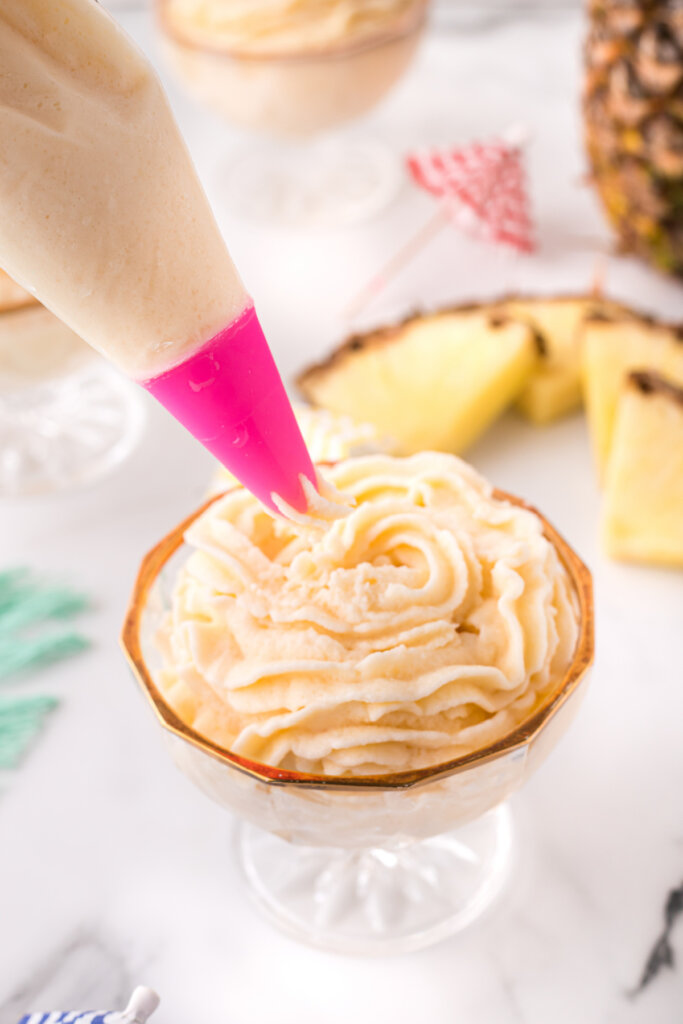 piping bag filling bowl with dole whip