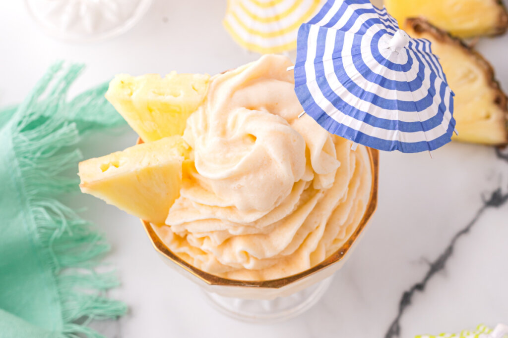 disney dole whip with blue and white striped umbrella