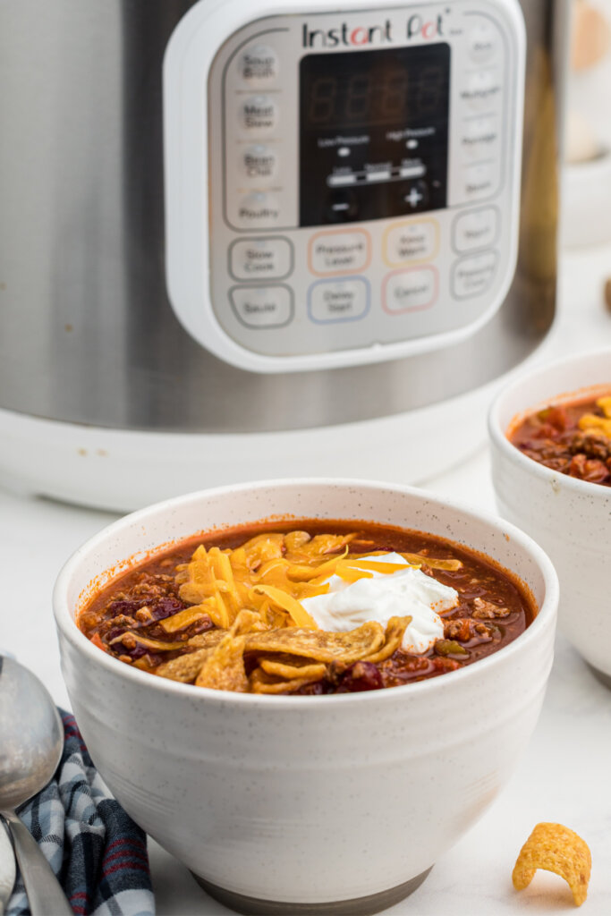 chili in bowl in front of instant pot