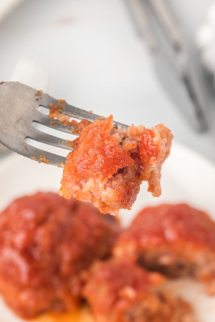 bite of ham balls on fork