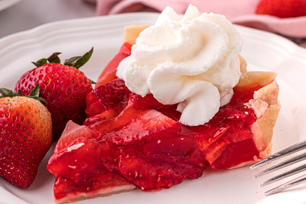 closeup strawberry pie slice on plate