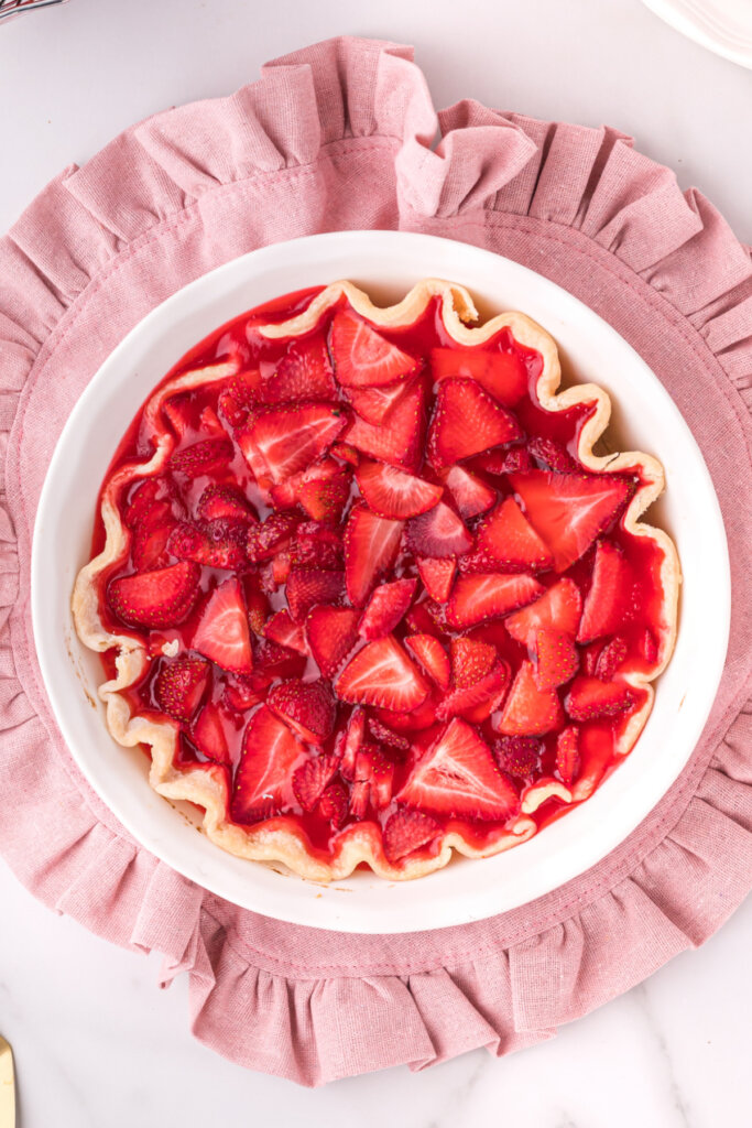 looking down onto a whole strawberry pie