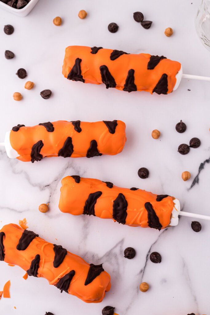 four tigger tails laying on table