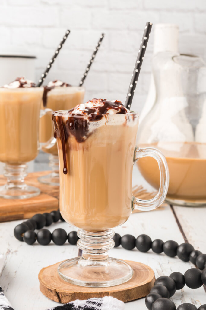 iced coffee in clear glass on wooden coaster