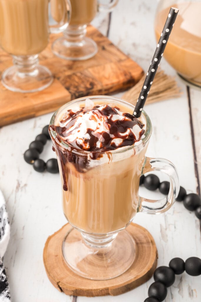 best iced coffee topped with whipped cream and chocolate drizzle