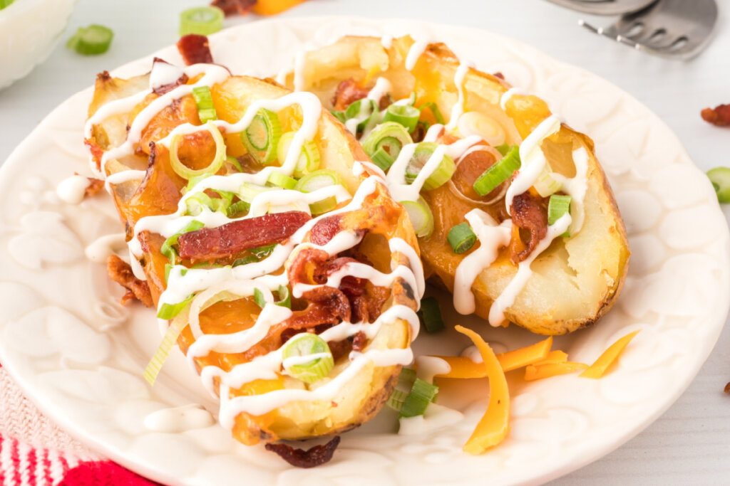 closeup of two potato skins on white plate